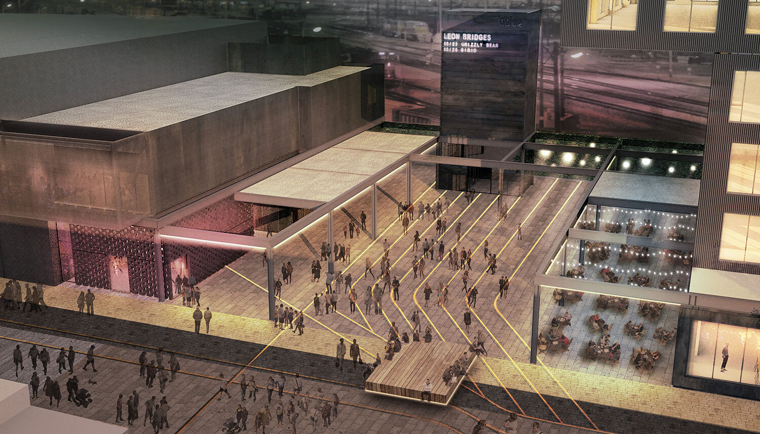 A digital perspective depicts a plaza between two venues full of people and lighting.