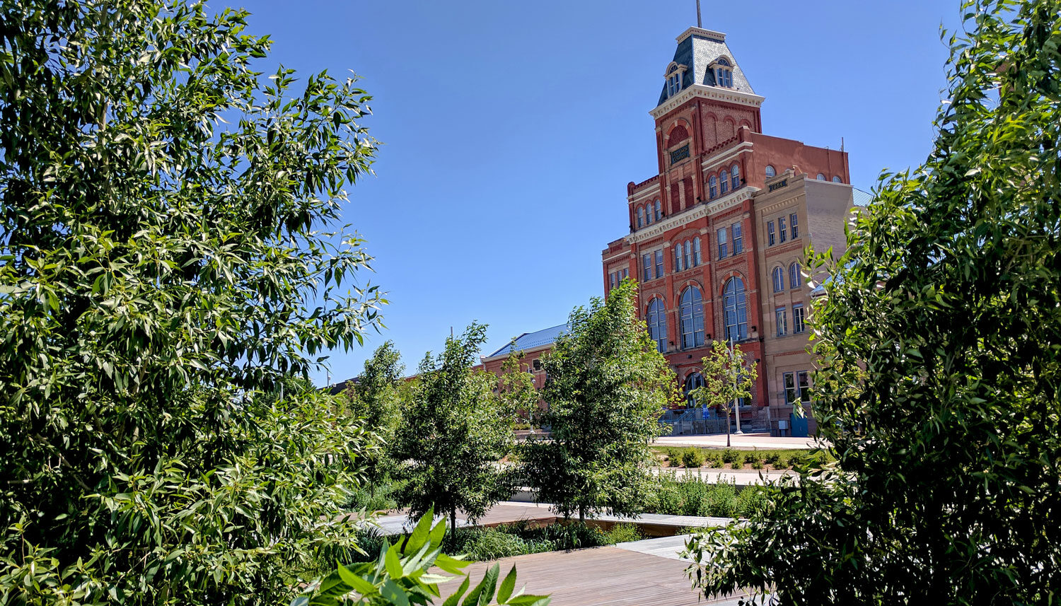 The Tivoli building is framed by tree canopy in the foregound.