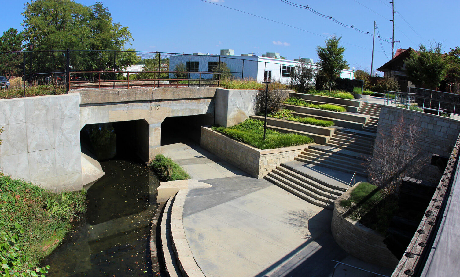 View from bridge of steps and planting terraces down to Boneyard Creek.