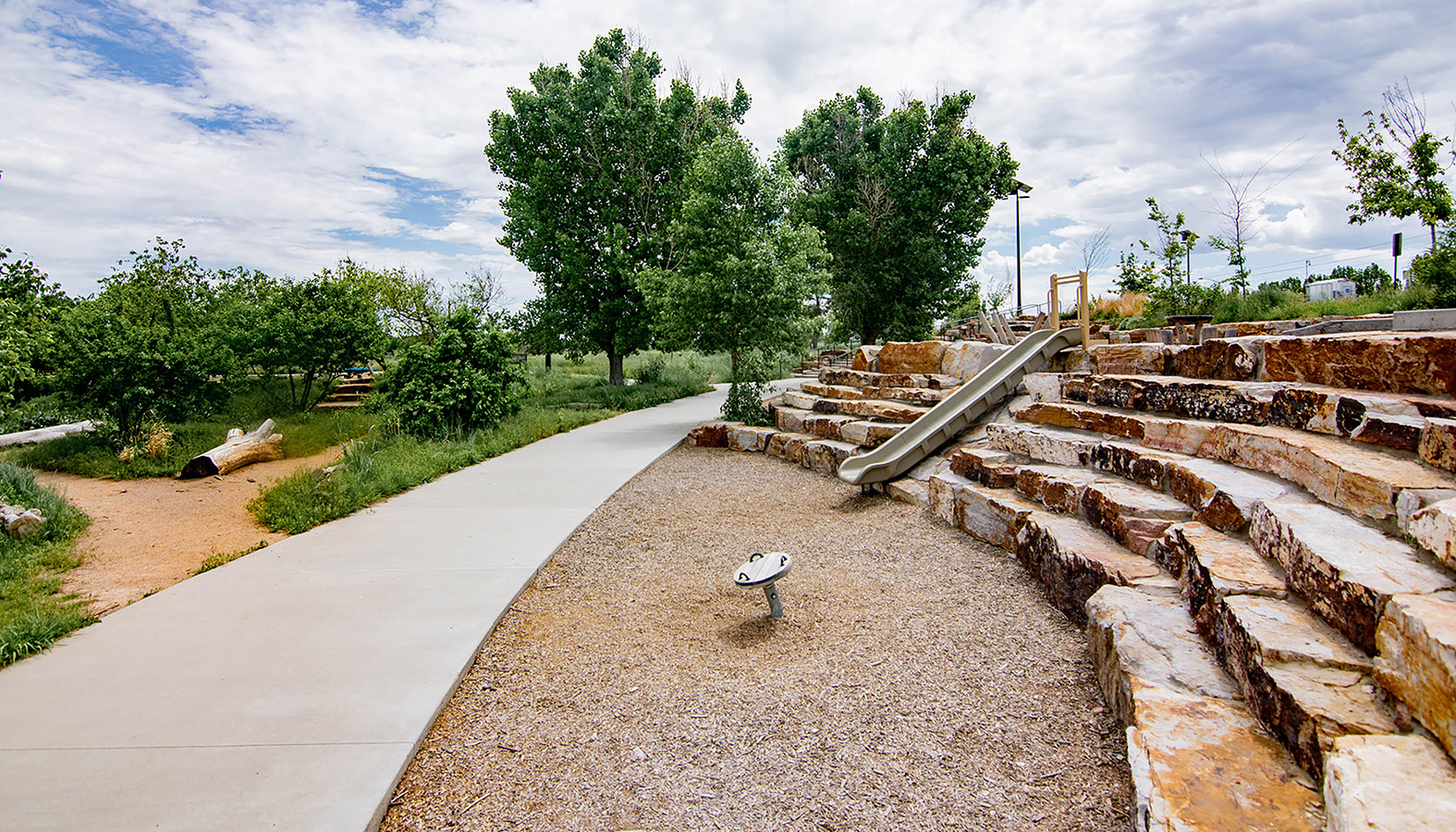 Sand Creek Park stone terraces and slide